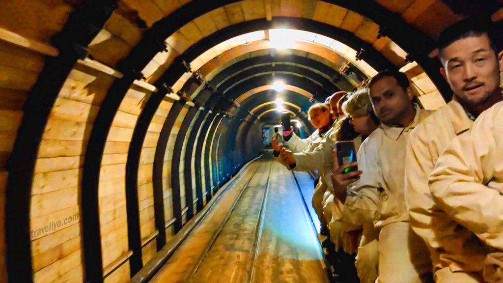 Group of tourists on guided Hallstatt salt mine tour Austria