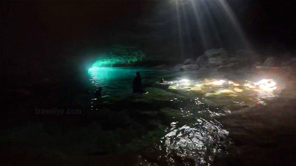 Reflections of sunlight on water inside Blue Cave Vanuatu