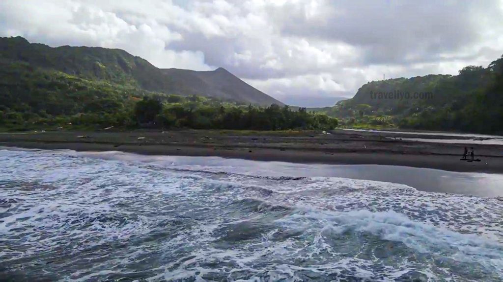 Volcanic black sand beach at sunset on Tanna Island, Vanuatu