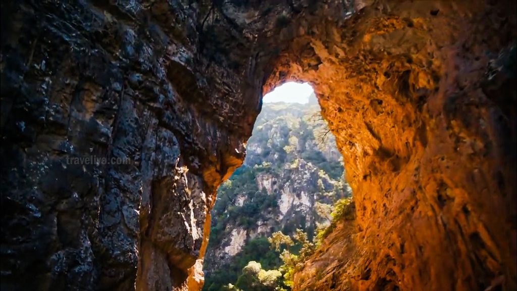 Sunlight streaming through a cave near Akchour waterfall close to Chefchaouen Morocco