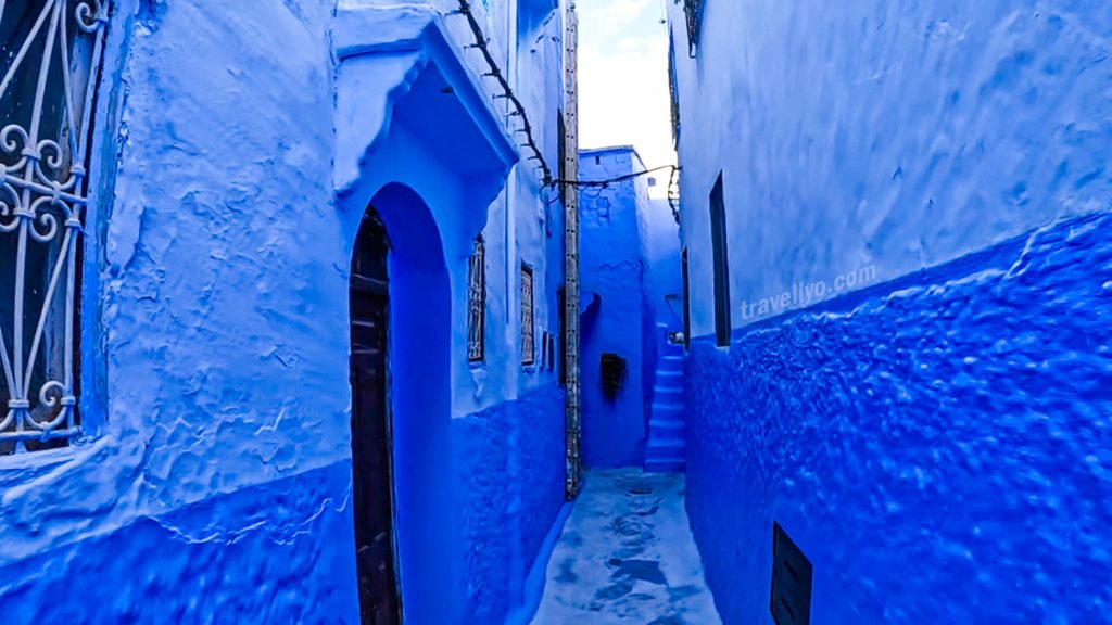 A narrow blue-painted alley in Chefchaouen Morocco