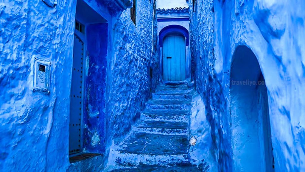 Blue stairway and traditional Moroccan doors in Chefchaouen old town