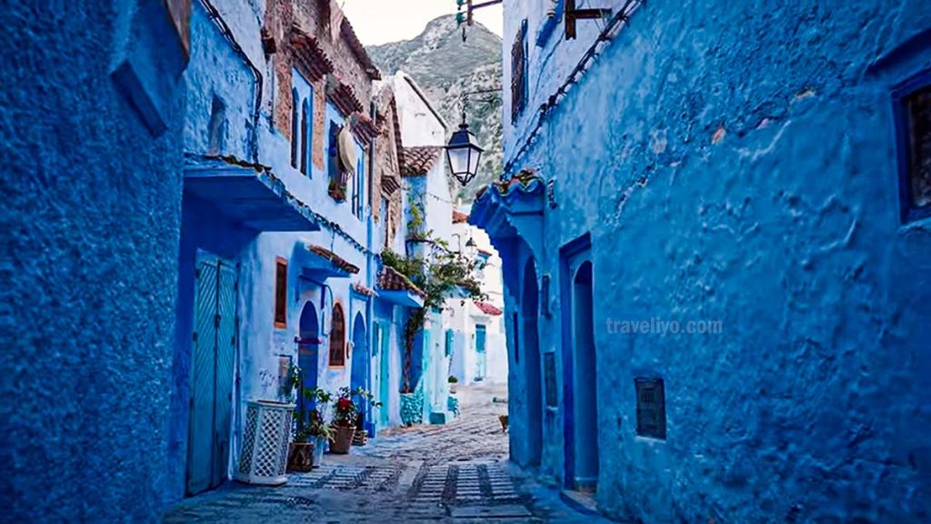 Iconic blue street in Chefchaouen Morocco with traditional houses