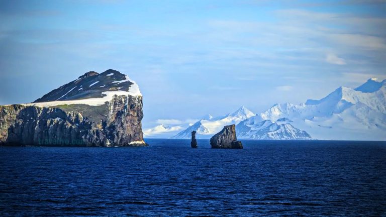 Deception Island tour - Scenic view of Deception Island’s rugged cliffs and icy Antarctic landscape