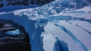 Neko Harbour Antarctica with towering cracked ice cliffs and deep blue water