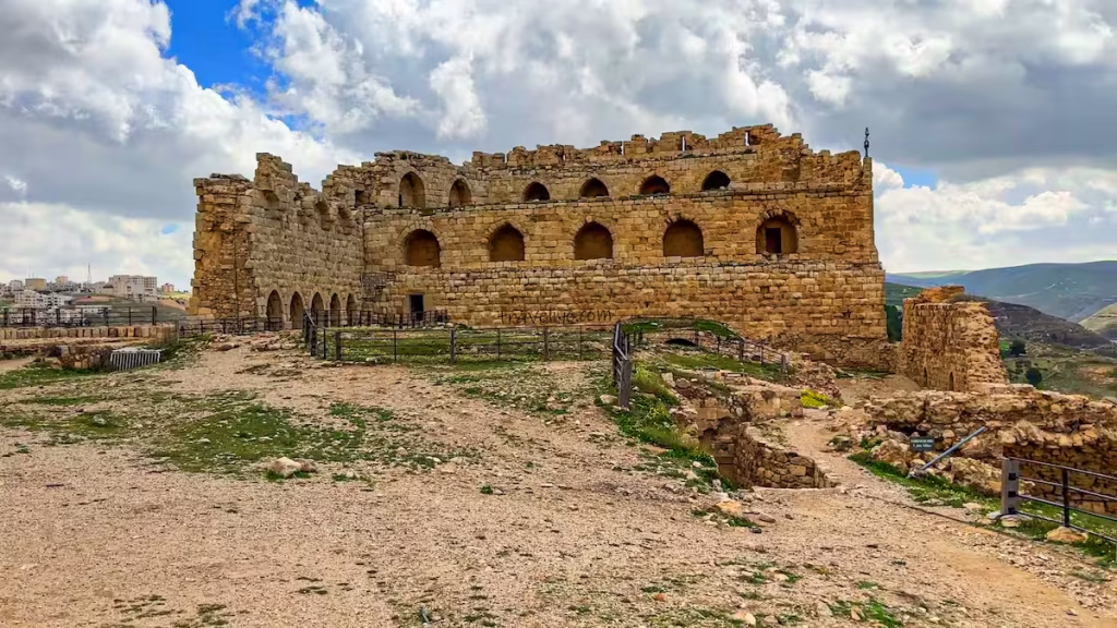The massive stone walls and underground passages of the Al-Karak Crusader Castle.