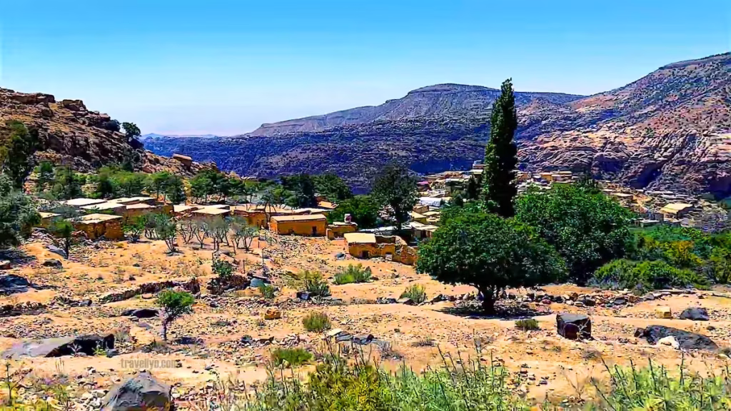 The ancient stone houses of Dana Village perched on a mountain cliff.