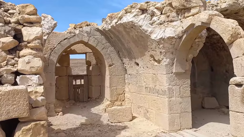A well-preserved pointed stone archway inside the Shobak Castle in Jordan.