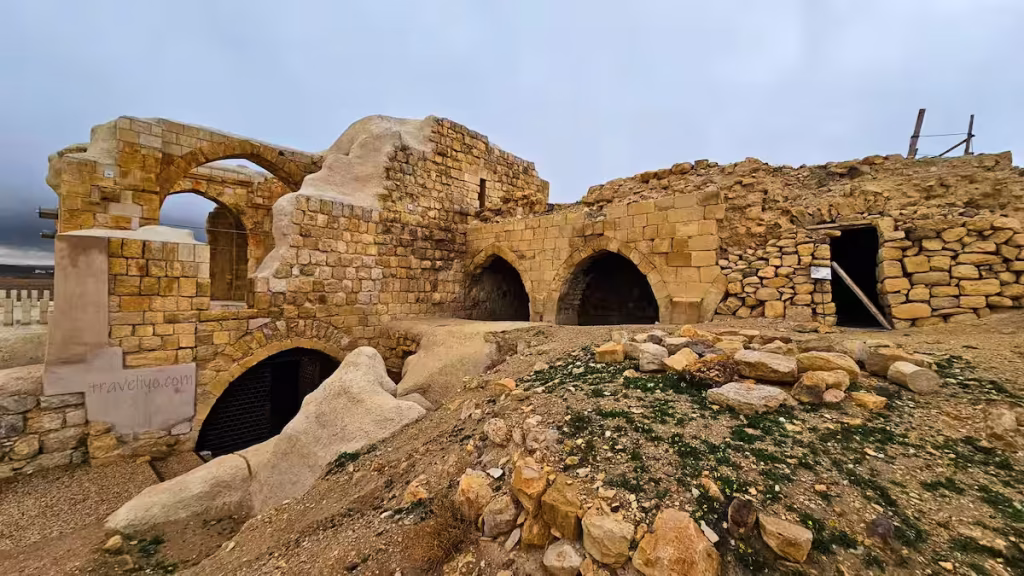 Multi-level ancient stone arches and rooms within the Shobak Castle in Jordan.