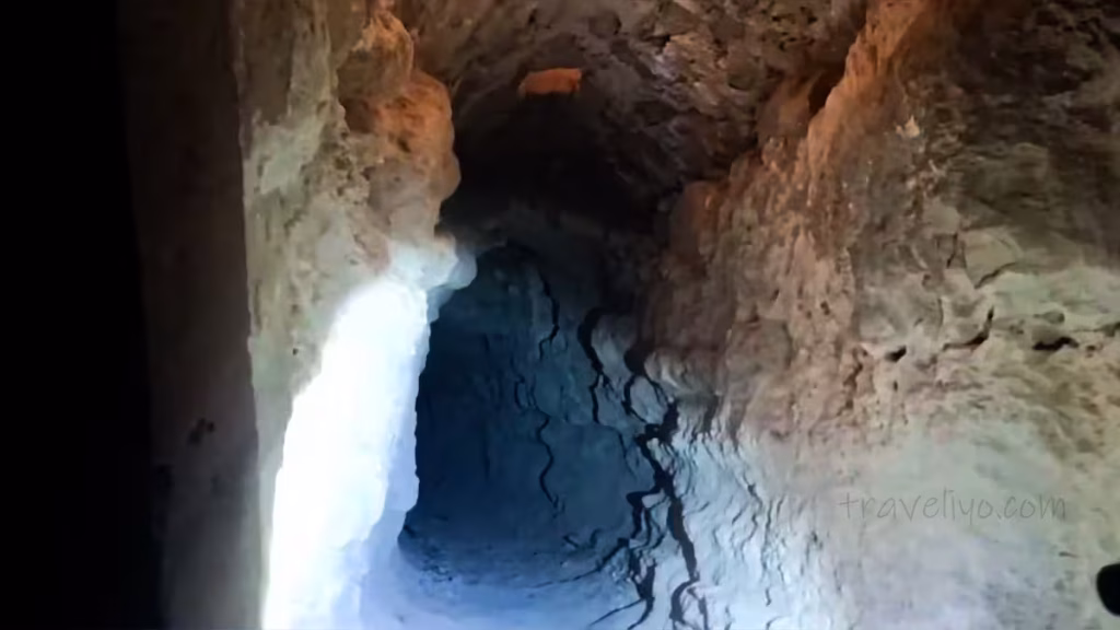 A deep, dark secret underground tunnel carved into the rock at Shobak Castle in Jordan.