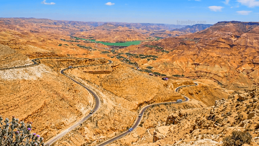 Winding mountain roads of the King's Highway cutting through the arid landscape of the Jordan grand canyon.