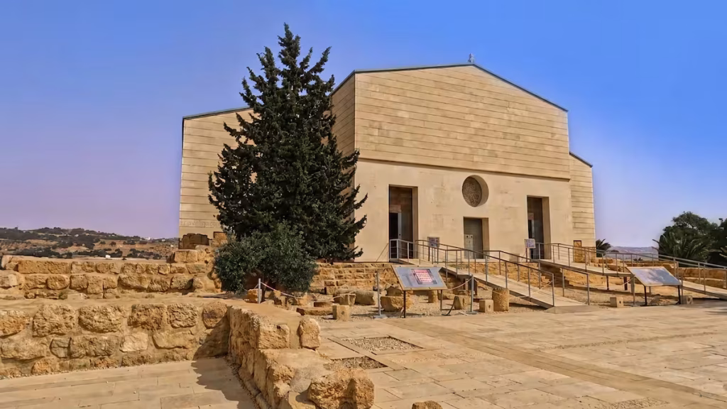 Exterior architecture of the modern protective structure sheltering the Moses Memorial Church.