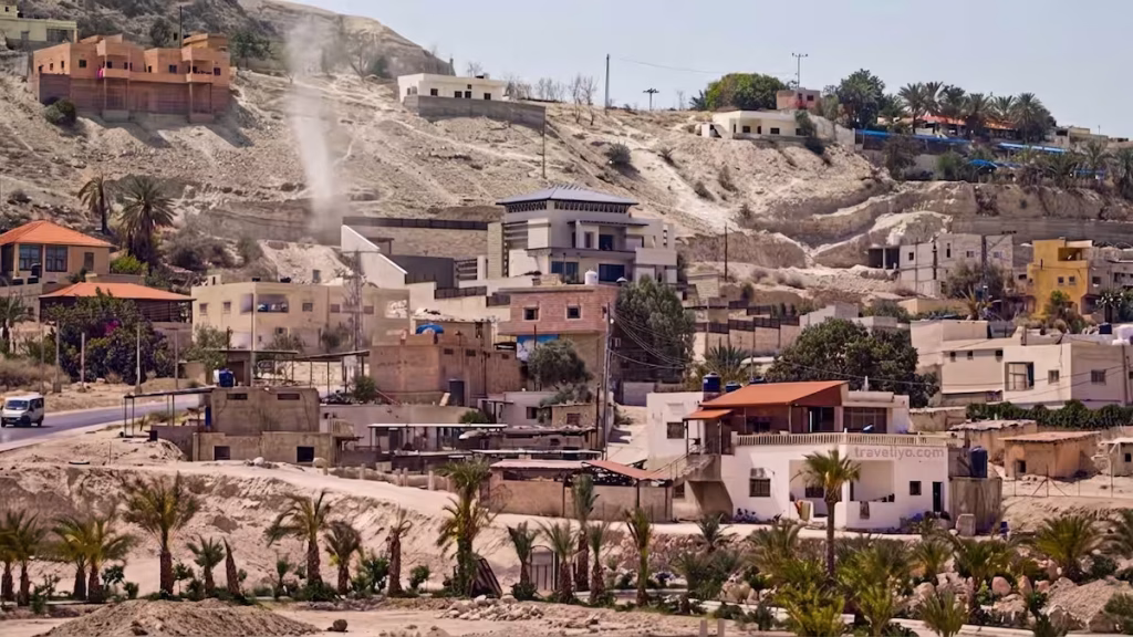 A hillside village landscape seen on the road between Mount Nebo and Madaba.