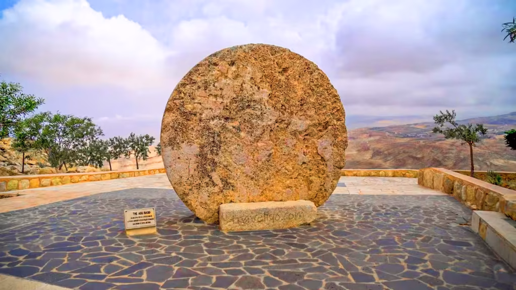 A close-up view of the historic circular rolling stone monument when visiting Mount Nebo.