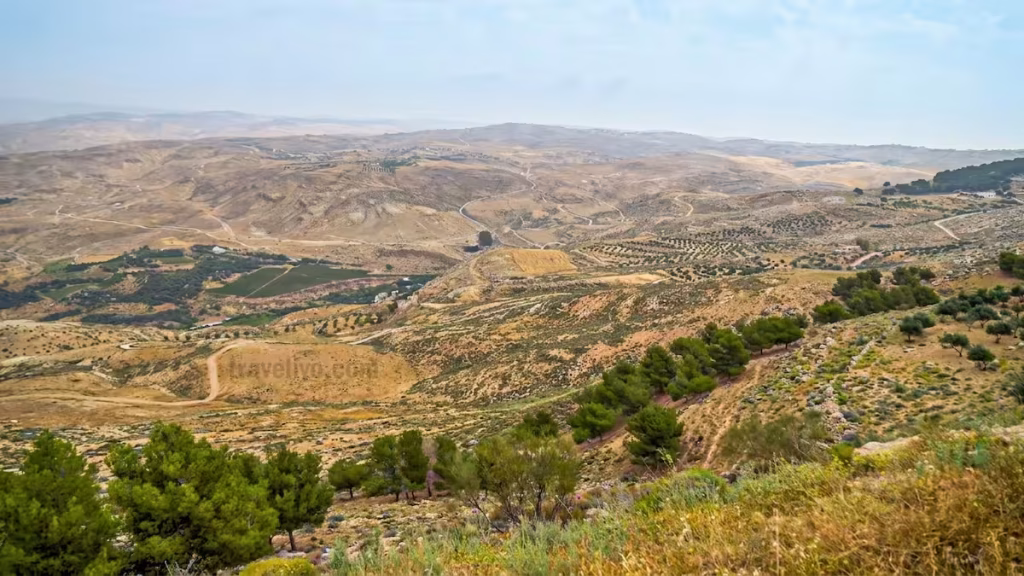 The biblical Promised Land overlook with rolling hills and arid valleys seen when visiting Mount Nebo.