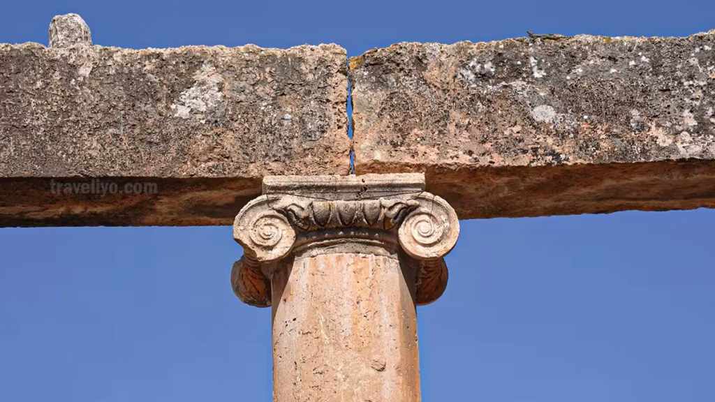 Close-up detail of Roman Ionic capital and architrave stone at Jerash Jordan ruins