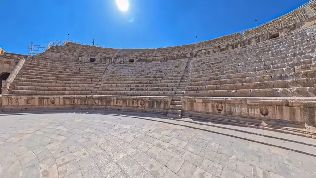 Curved stone seating rows inside the Roman South Theater in Jerash Jordan